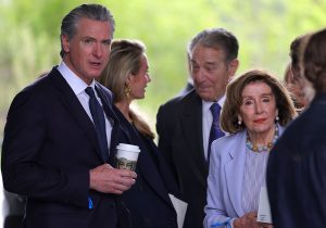 CHICAGO, ILLINOIS - JUNE 18: California Gov. Gavin Newsom (L) and former Speaker of the House Nancy Pelosi (D-CA) attend the dedication ceremony for the opening of the Barack Obama Presidential Center in John Lewis Plaza on June 18, 2026 in Chicago, Illinois. Barack Obama served as the 44th president of the United States from 2009 to 2017 and was the first African American to hold the office. (Photo by Jim Vondruska/Getty Images)