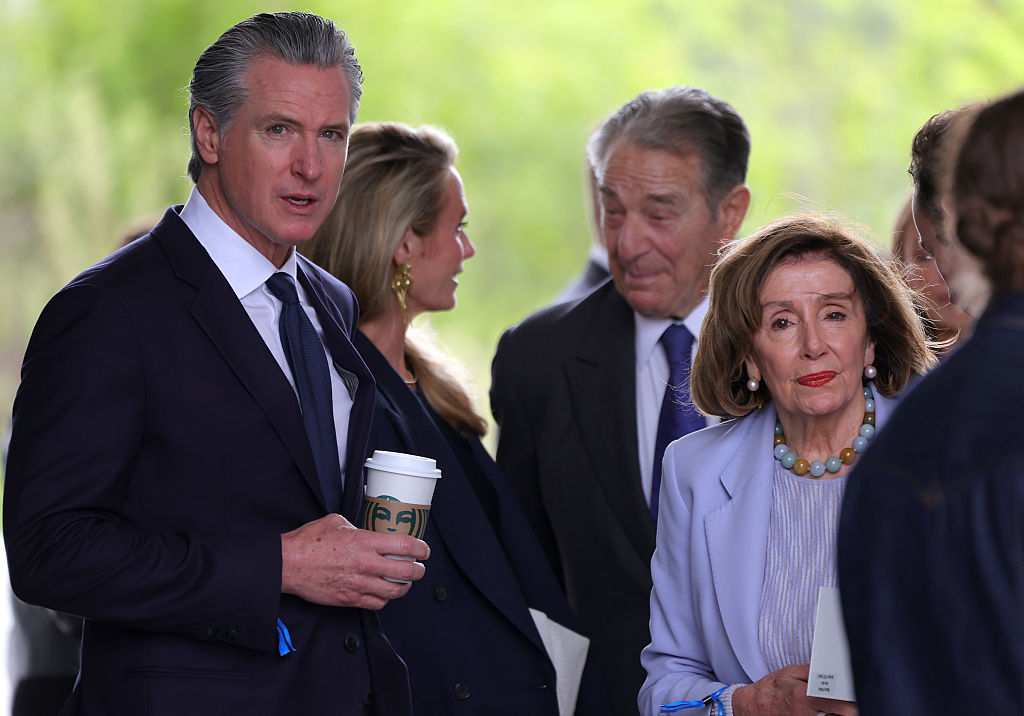 CHICAGO, ILLINOIS - JUNE 18: California Gov. Gavin Newsom (L) and former Speaker of the House Nancy Pelosi (D-CA) attend the dedication ceremony for the opening of the Barack Obama Presidential Center in John Lewis Plaza on June 18, 2026 in Chicago, Illinois. Barack Obama served as the 44th president of the United States from 2009 to 2017 and was the first African American to hold the office. (Photo by Jim Vondruska/Getty Images)