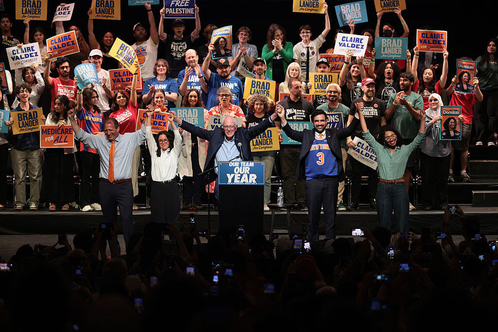 Bernie Sanders And Zohran Mamdani Join Local Candidates For Campaign Rally Ahead Of Primary Election In New York NEW YORK, NEW YORK - JUNE 18: Congressional candidate Brad Lander, Congressional candidate Claire Valdez, Sen. Bernie Sanders (I-VT), Mayor Zohran Mamdani, and Congressional candidate Darializa Avila Chevalier raise their hands during a Get Out the Vote (GOTV) rally at Kings Theater on June 18, 2026 in New York City. Sen. Bernie Sanders (I-VT) joined Mayor Zohran Mamdani ahead of next week's primary, and the start of early voting on Saturday, as the pair campaigned for Brad Lander, Claire Valdez and Darializa Avila Chevalier, who are challenging incumbents in Democratic primary contests. (Photo by Michael M. Santiago/Getty Images)