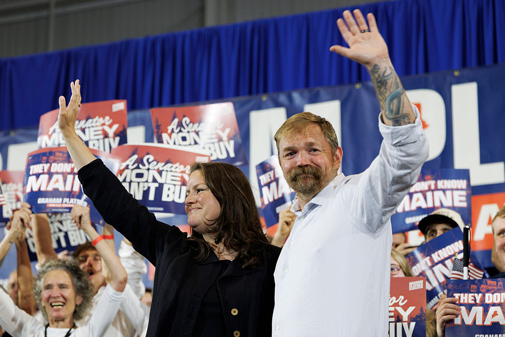 Democratic U.S. Senate candidate Graham Platner and his wife Amy Gertner wave to supporters as they arrive to Platner's Primary Election event on June 9, 2026 in Blue Hill, Maine.