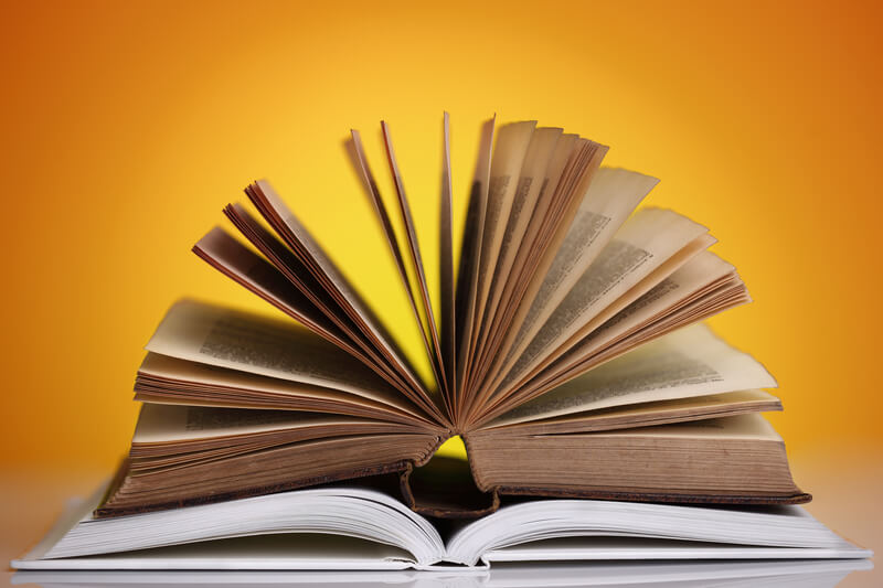 Books open on a bright background