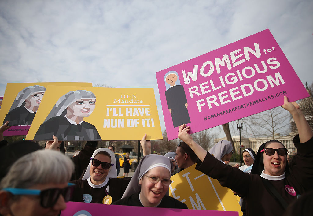 Nuns supporting Little Sisters of the Poor, attend a rally in front of the US Supreme Court, March 23, 2016 in Washington, DC.